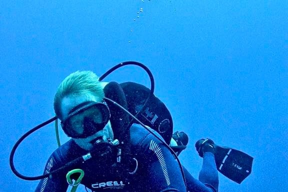 a man swimming in a body of water